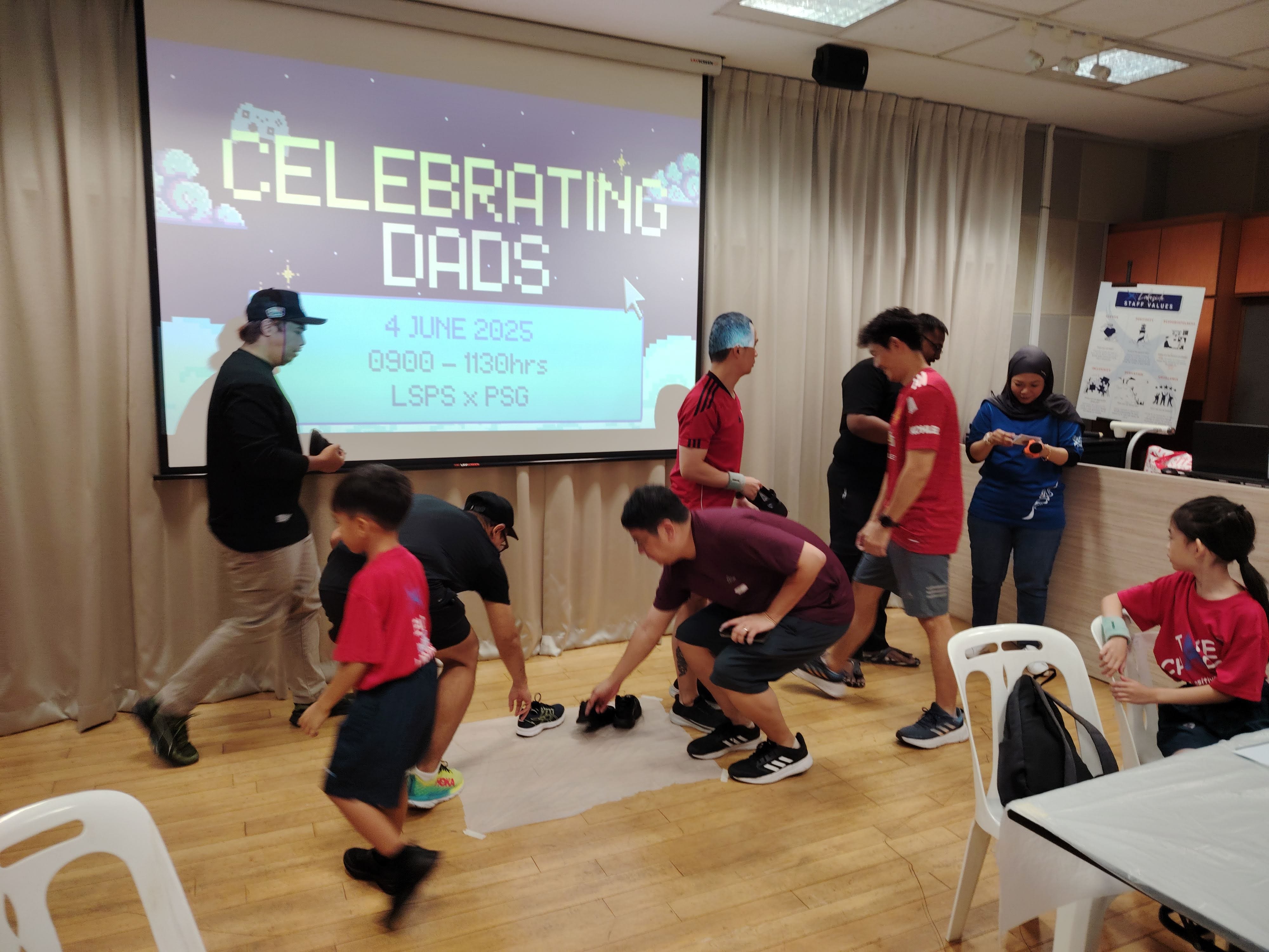 Students and their fathers participate in activity 1 – The Sole Search 